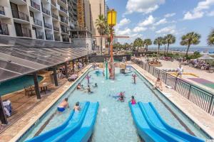a pool at a resort with people playing in it at Breakers Resort in Myrtle Beach