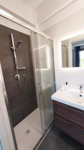 a bathroom with a shower and a sink at NUMANA SEA APARTMENT in Numana