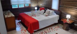 Postel nebo postele na pokoji v ubytování HOTEL IGUAIMA