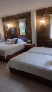 Postel nebo postele na pokoji v ubytování HOTEL IGUAIMA