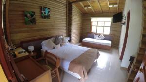Postel nebo postele na pokoji v ubytování HOTEL IGUAIMA