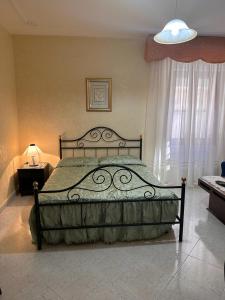 Postel nebo postele na pokoji v ubytování B&B Grazia Deledda