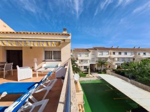 a view from the balcony of a house with a green lawn at CABO DE PALOS ATICO LA GALERA parking in Cabo de Palos