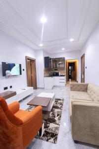 TV a/nebo společenská místnost v ubytování Tranquila Hotels and Suites Abuja