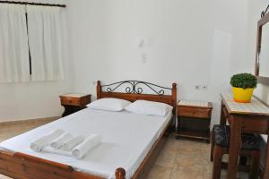Postel nebo postele na pokoji v ubytování Morfeas Hotel