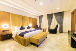 Letto o letti in una camera di Tranquila Hotels and Suites Abuja