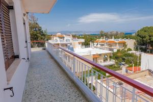 a balcony with a view of a city at Zoumperi Nea Makri 4-5 guest apt big balconies 5 min to beach in Nea Makri