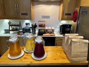 a kitchen with two jars of honey on a table at The Riverhouse in Cardiff