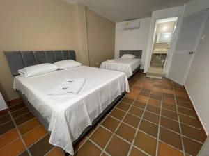 Voodi või voodid majutusasutuse Hotel Valle Central toas