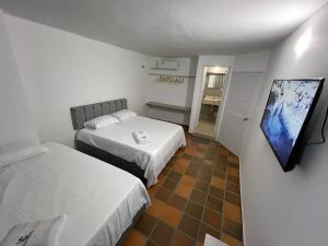 Voodi või voodid majutusasutuse Hotel Valle Central toas