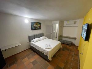 Voodi või voodid majutusasutuse Hotel Valle Central toas