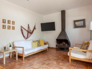 a living room with a couch and a fireplace at BEAUTIFUL HOUSE in TOSSA in Tossa de Mar