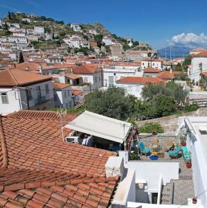 a view of a city with a white roof at Maria's House in Hydra