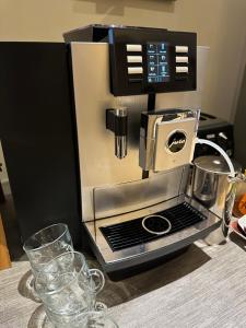 a coffee maker sitting on top of a table at Number One Hundred Bed And Breakfast in Cardiff