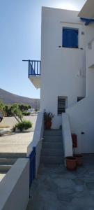 a stairway leading to a white building with a stair case at Aegean Dream House in Kamarai +67 photos