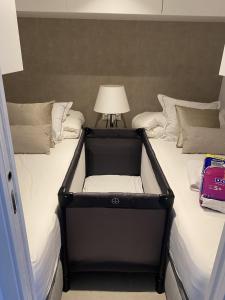A bed or beds in a room at Puente Romano Hotel Apartment Marbella