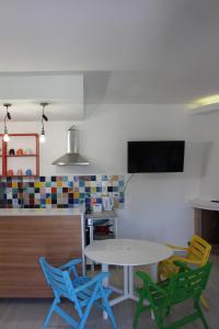 a kitchen with a table and four chairs at LE CANONICHE NEL MATESE ALBERGO DIFFUSO in San Massimo