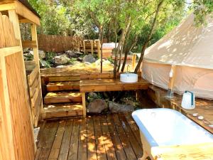 a yurt with a toilet on a wooden deck at Corsica Natura #2 in Coti-Chiavari