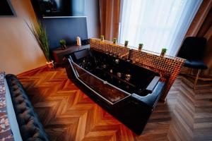 TV a/nebo společenská místnost v ubytování Apartament Pod Skrzydłami Aniola
