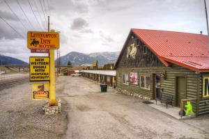 a sign in front of a train station at Livingston Inn in Livingston