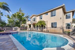a swimming pool in front of a building at Luxury Encinitas Vacation Rental with Private Pool in Encinitas