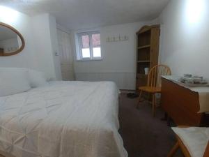 Postel nebo postele na pokoji v ubytování The Hidden Nest - 3 Bedroom Family Home in Denbigh
