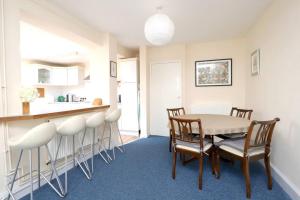 a kitchen and dining room with a table and chairs at Wolsey Road, North Oxford in Oxford