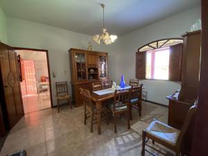 a dining room with a wooden table and chairs at Casa Raiz in Valença +22 photos