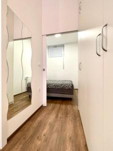 Tempat tidur dalam kamar di Nala Apartment