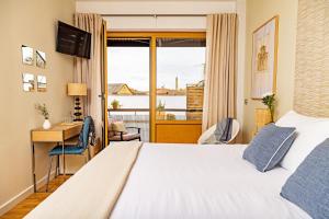 Postel nebo postele na pokoji v ubytování Eco-Hotel Doña Mayor