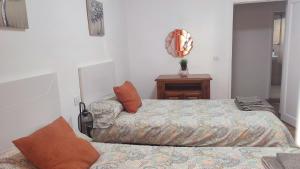 Postel nebo postele na pokoji v ubytování Casa" VISTAS AL TEIDE" mar Piscina privada parking cubierto gratuito en las instalaciones