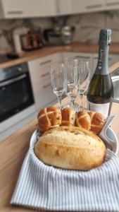 a plate of bread and wine glasses on a table at Rydal house with office space newly refurbished in Newton-le-Willows
