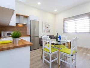 a kitchen and dining room with a table and chairs at Esquina de Alberto N1 con WiFi, cerca de la playa en Garachico - ES-279-3 in Garachico +13 photos