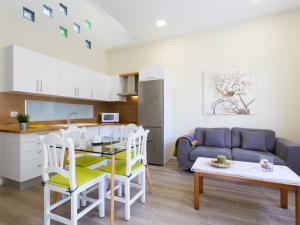 a kitchen and living room with a table and a couch at Esquina de Alberto N1 con WiFi, cerca de la playa en Garachico - ES-279-3 in Garachico