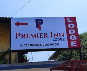 a sign for a premier inn lodge on a building at PREMIER INN LODGE in Mangalore