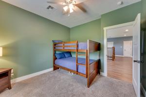 a bedroom with bunk beds in a room at Spacious Lake Charles Craftsman - Pet Friendly! in Lake Charles