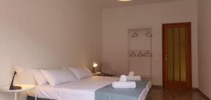 a bedroom with a bed with two towels on it at Casa Andrea Teror in Teror