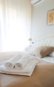 Postel nebo postele na pokoji v ubytování B&B Greco Home