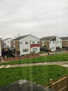 a group of houses in a yard with grass at Shielded Serenity - 3 BR House in South Shields