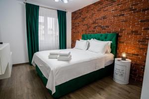 ApartBnb Green Vibe 32 tesisinde bir odada yatak veya yataklar