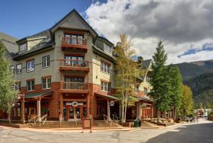 a large wooden building in the mountains at Jackpine & Black Bear Condominiums by Keystone Resort in Keystone
