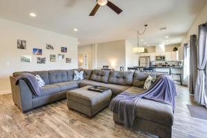 a living room with a couch and a table at Updated Las Vegas House with Patio, Solar Heated Pool in Las Vegas