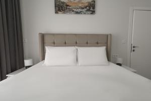 Postel nebo postele na pokoji v ubytování Charming and Central Flat near Beach in Muratpasa