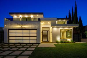 a house with a garage at night at Curson Modern in Los Angeles