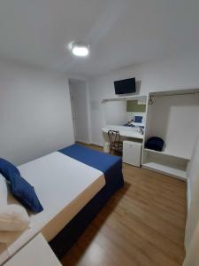 Llit o llits en una habitació de Summit Suítes Hotel Paulista