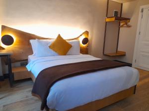 A bed or beds in a room at Taksimbul Design Hotel