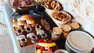 a table with a bunch of different types of food at Domaine de la Citerne in Nans-les-Pins