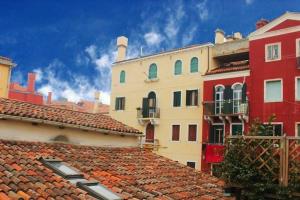 a group of buildings with red roofs at Ca' Spendore del Sole in Venice