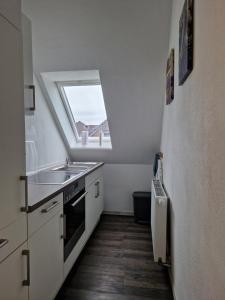 Dapur atau dapur kecil di Ferienwohnung Wellenbrecher