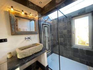 a bathroom with a sink and a mirror at Cortijito dúplex Mangueta in El Palmar +42 photos
